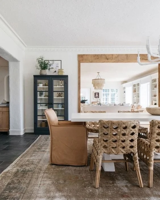 Modern dining room idea mixng and mathing dining room chairs around the table.