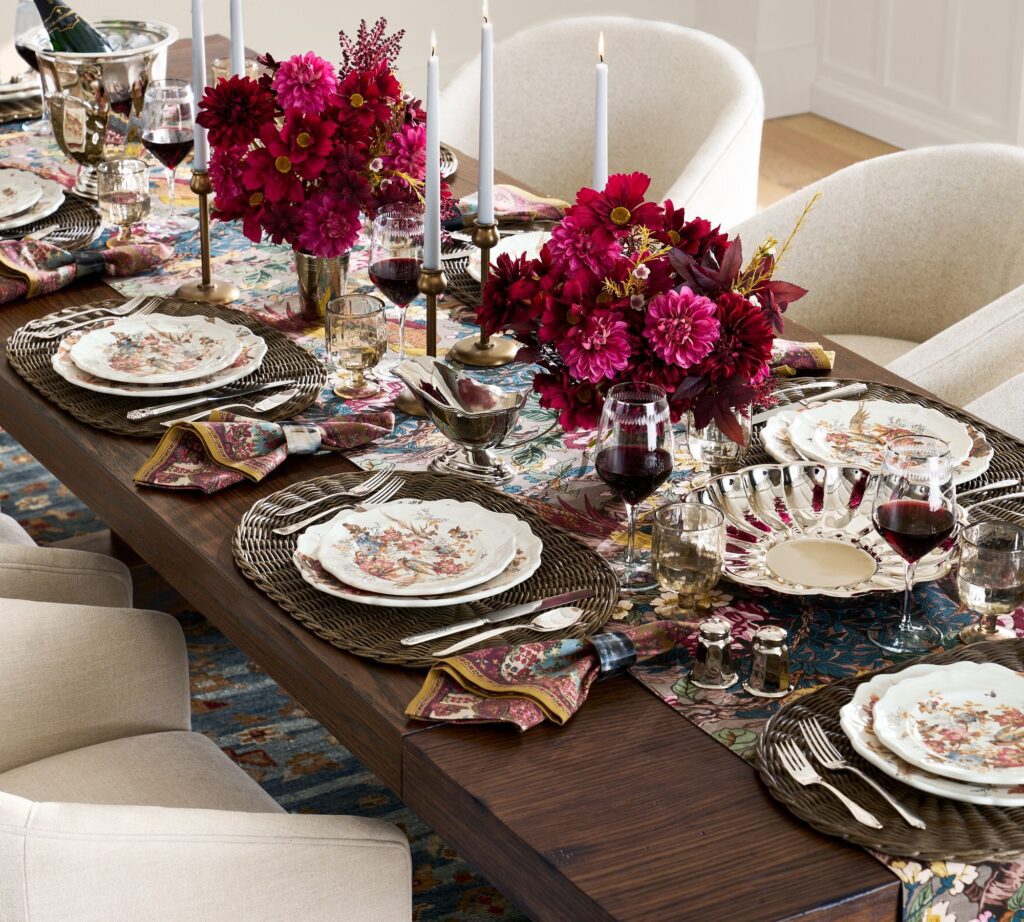 Thanksgiving table ideas include comfortable seating like this Potery Barn table with soft upholstered chairs.