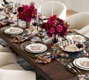 Thanksgiving table ideas include comfortable seating like this Potery Barn table with soft upholstered chairs.