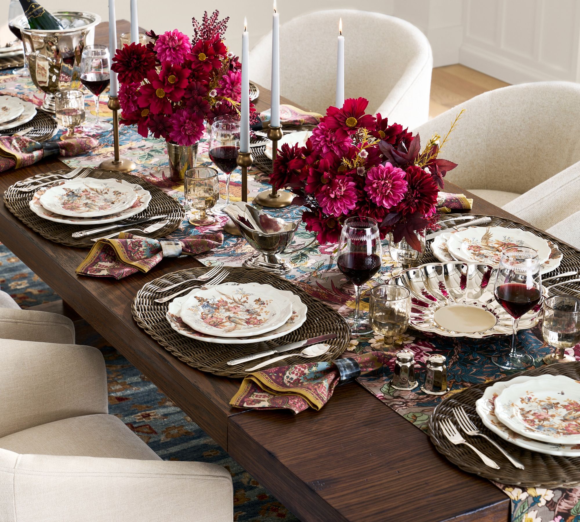 Thanksgiving table ideas include comfortable seating like this Potery Barn table with soft upholstered chairs.