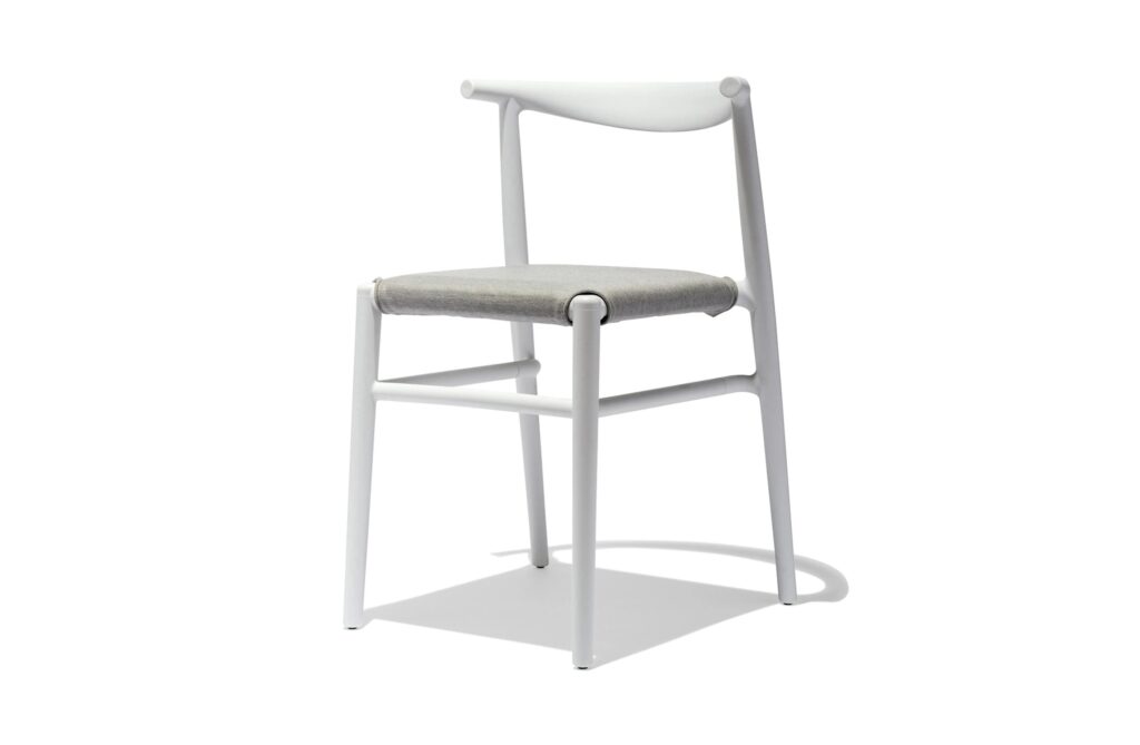 Industry West's white dining chair with woven seat from our affordable modern dining chairs guide.