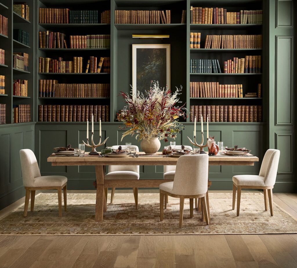 Dining room with striking greenery in a vase from our modern holiday hosting ideas guide.