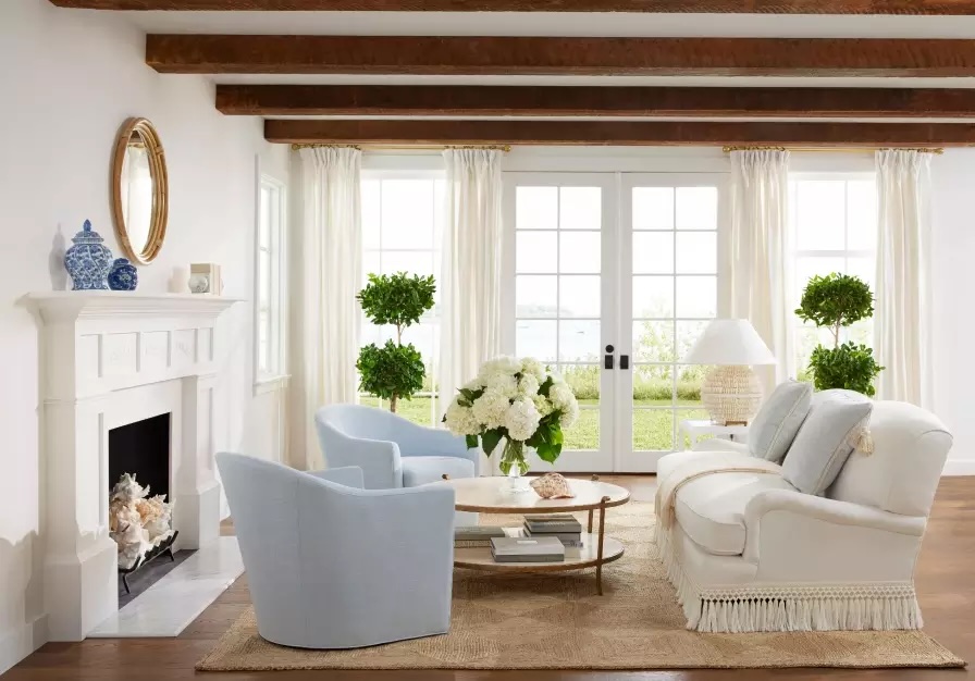 Modern living room with a rounded accent chair layered into a structured seating arrangement.