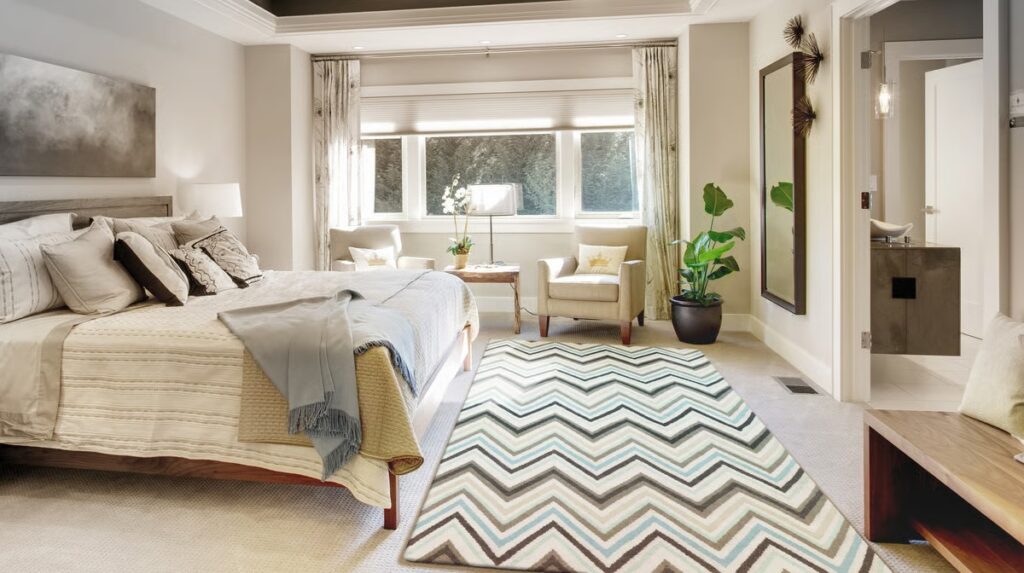 Chevron pattern rug integrated into a neutral modern interior.