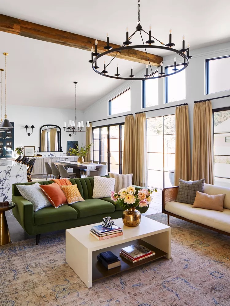 Modern open concept living and dining space with defined zones.