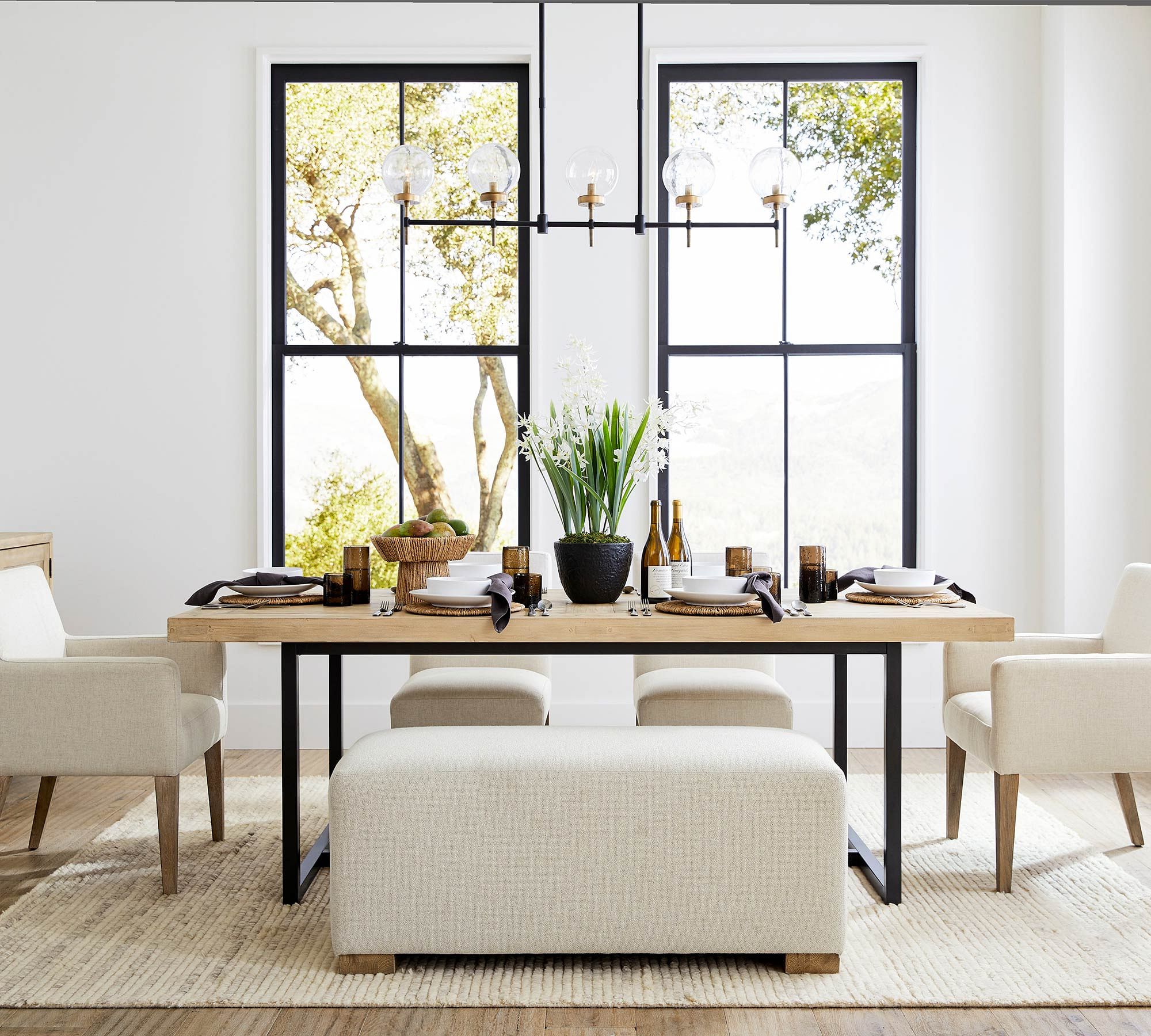 Dining room chandelier positioned at the correct height above a table for proper proportion.