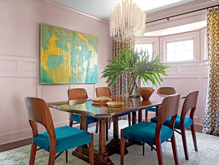 Dining room with one large-scale artwork piece balancing the space.