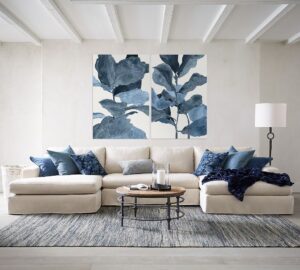 Modern living room with large-scale artwork above the sofa.